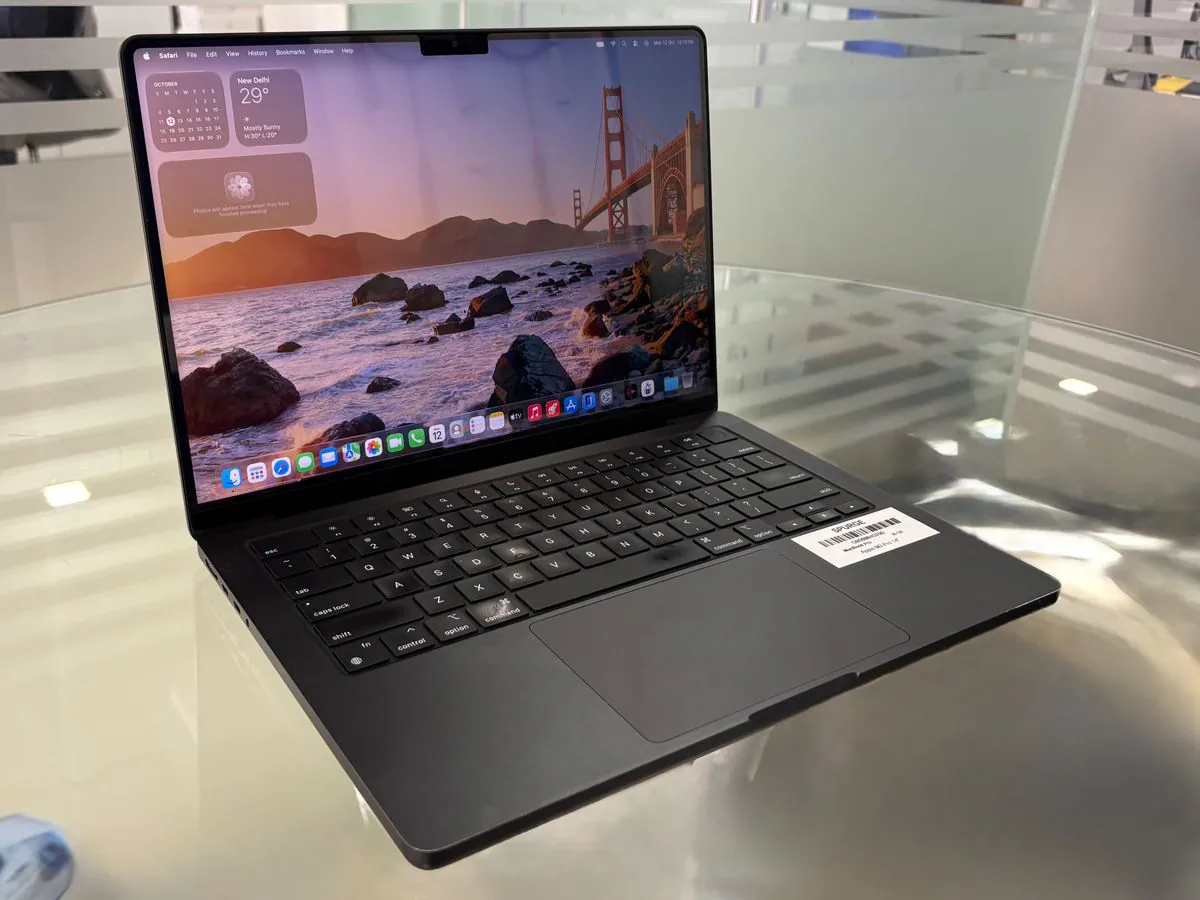 MacBook Pro 14-inch M3 Pro from a front-left three-quarter angle, open with the display on