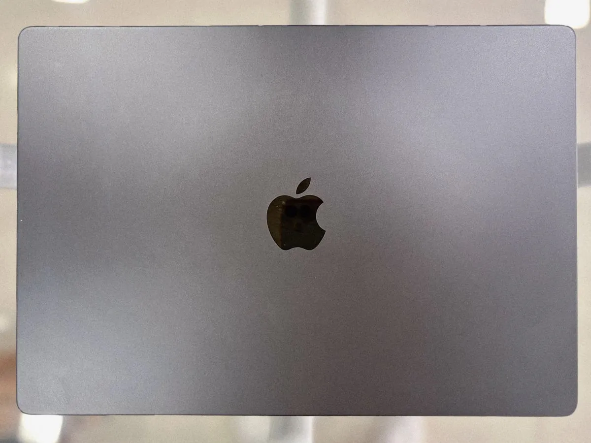 MacBook Pro 16-inch M3 Max closed, lid facing up showing the Apple logo