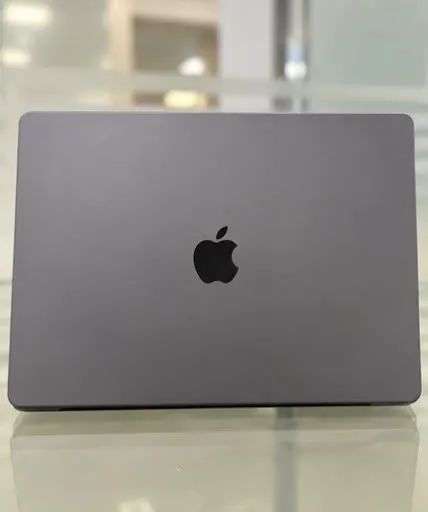 MacBook Pro 16-inch M3 Pro closed, lid facing up showing the Apple logo