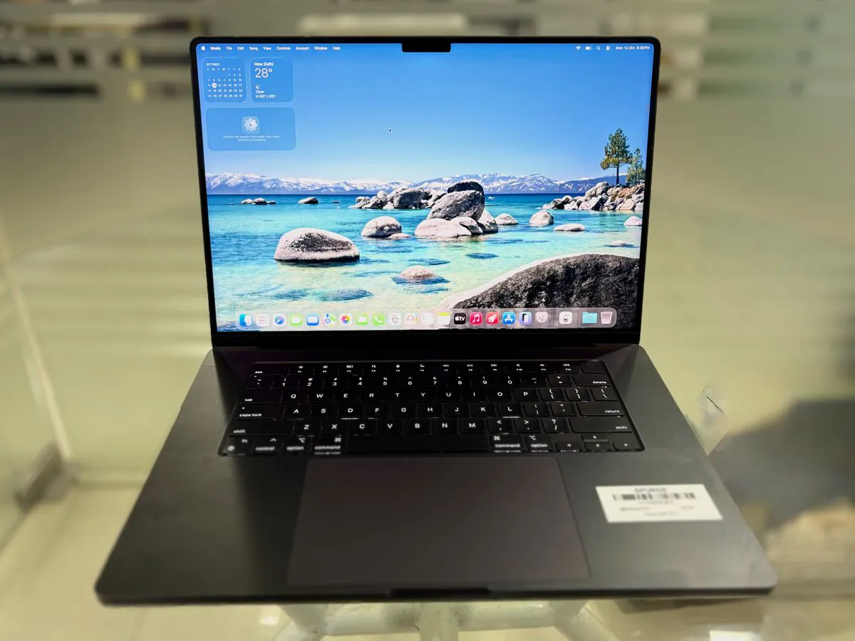 MacBook Pro 16-inch M4 Pro in Space Black, open facing the camera, showing the full keyboard, Force Touch trackpad and Liquid Retina XDR display