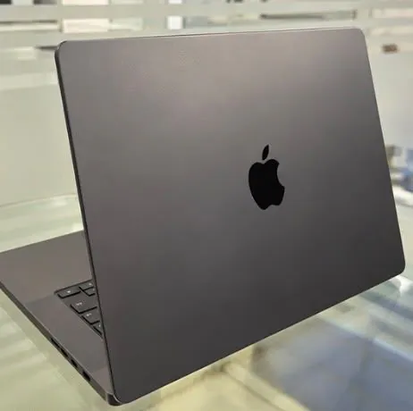 MacBook Pro 16-inch M4 Pro closed, three-quarter view of the Space Black lid with the Apple logo