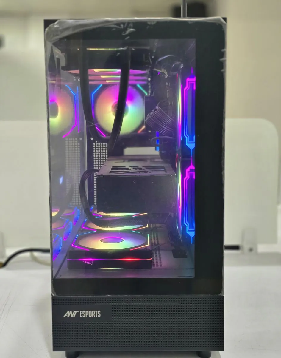 ASUSTeK Pro PC Z890 Creator WiFi straight-on view through the glass end panel, showing RGB fans and the liquid-cooling tubes