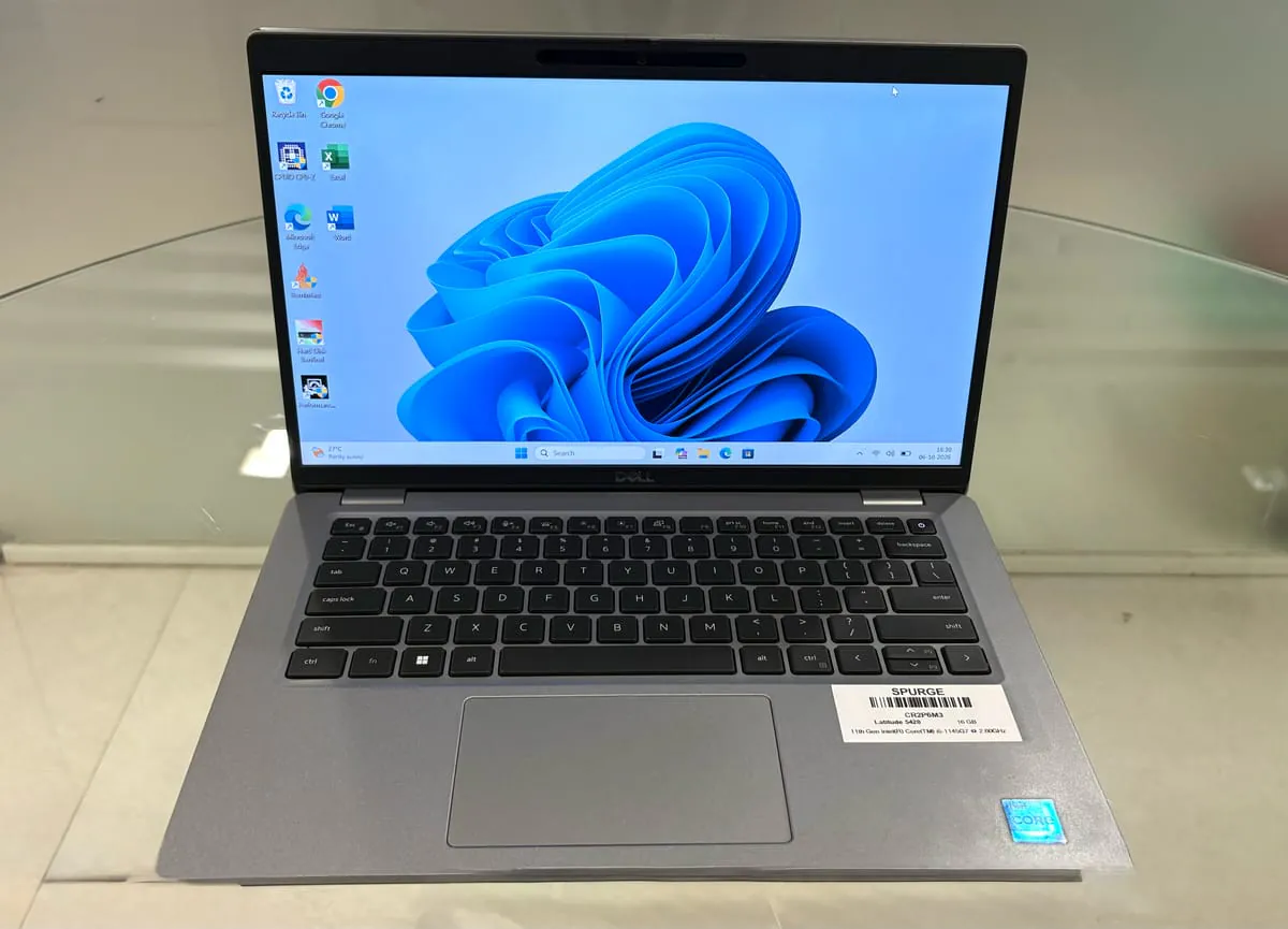 Dell Latitude 5420, open facing the camera with the Windows desktop on, showing the 14-inch display, keyboard and trackpad