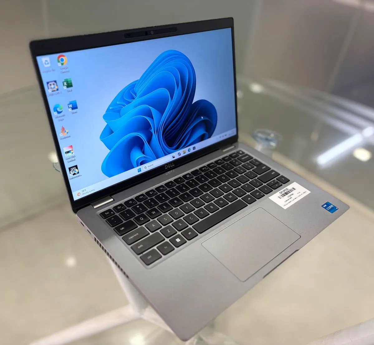 Dell Latitude 5420, open, three-quarter view from the left showing the display, keyboard and left-side vents and ports