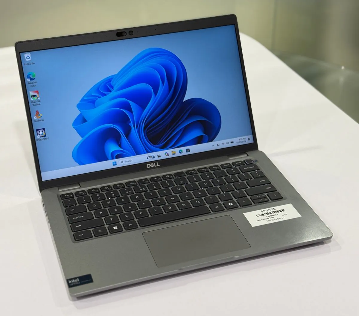 Dell Latitude 5450, open three-quarter view from the left.