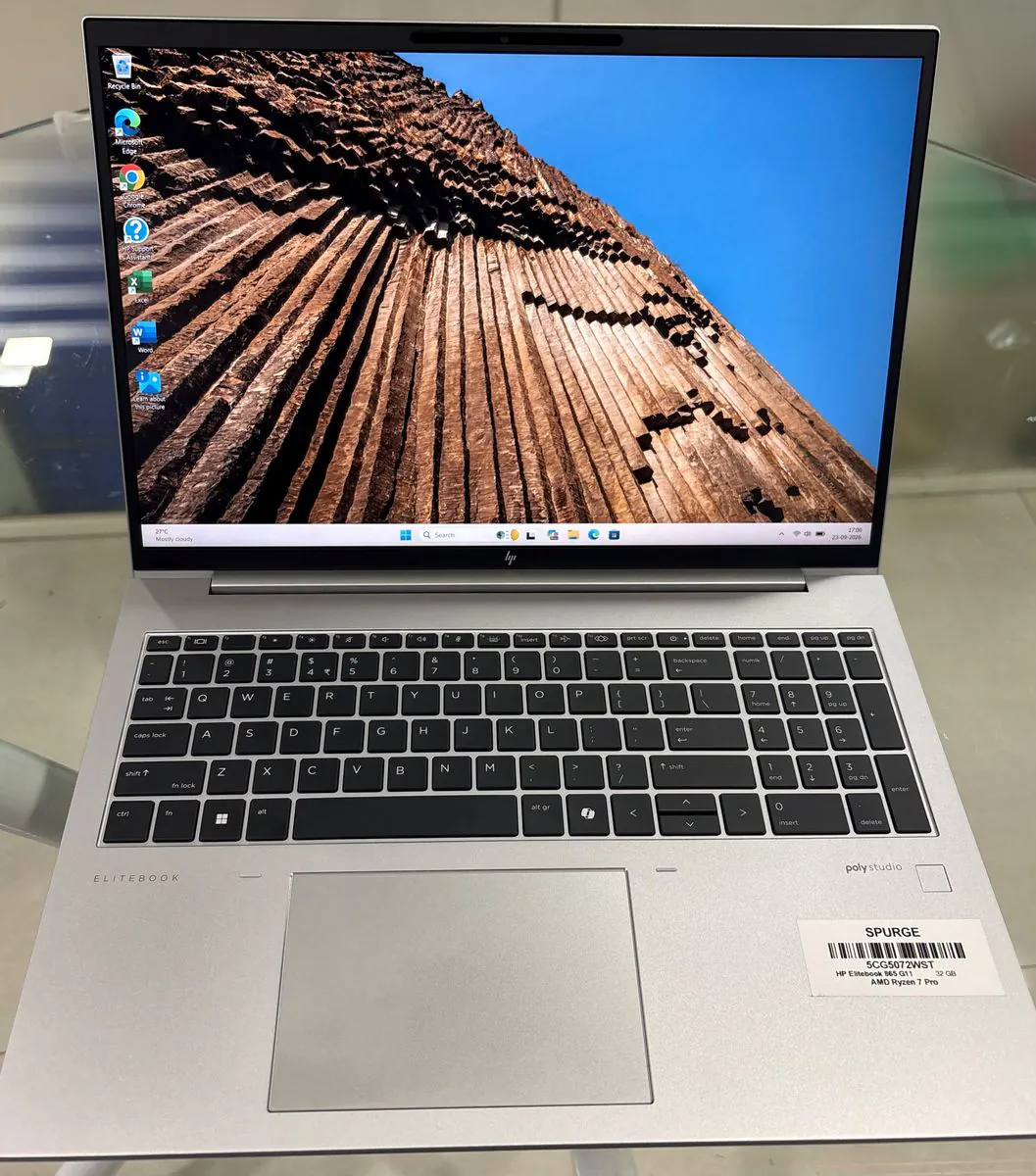 HP EliteBook 865 G11 open facing the camera, showing the 16-inch display, keyboard with numeric keypad, touchpad and fingerprint reader