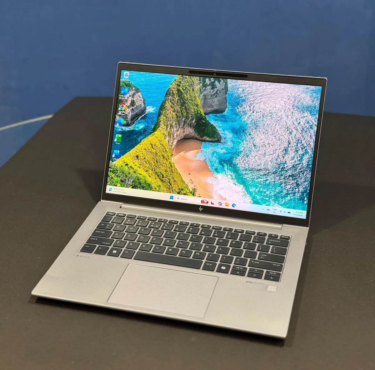 HP ZBook Firefly 14 G11 A from a left three-quarter angle with the display on