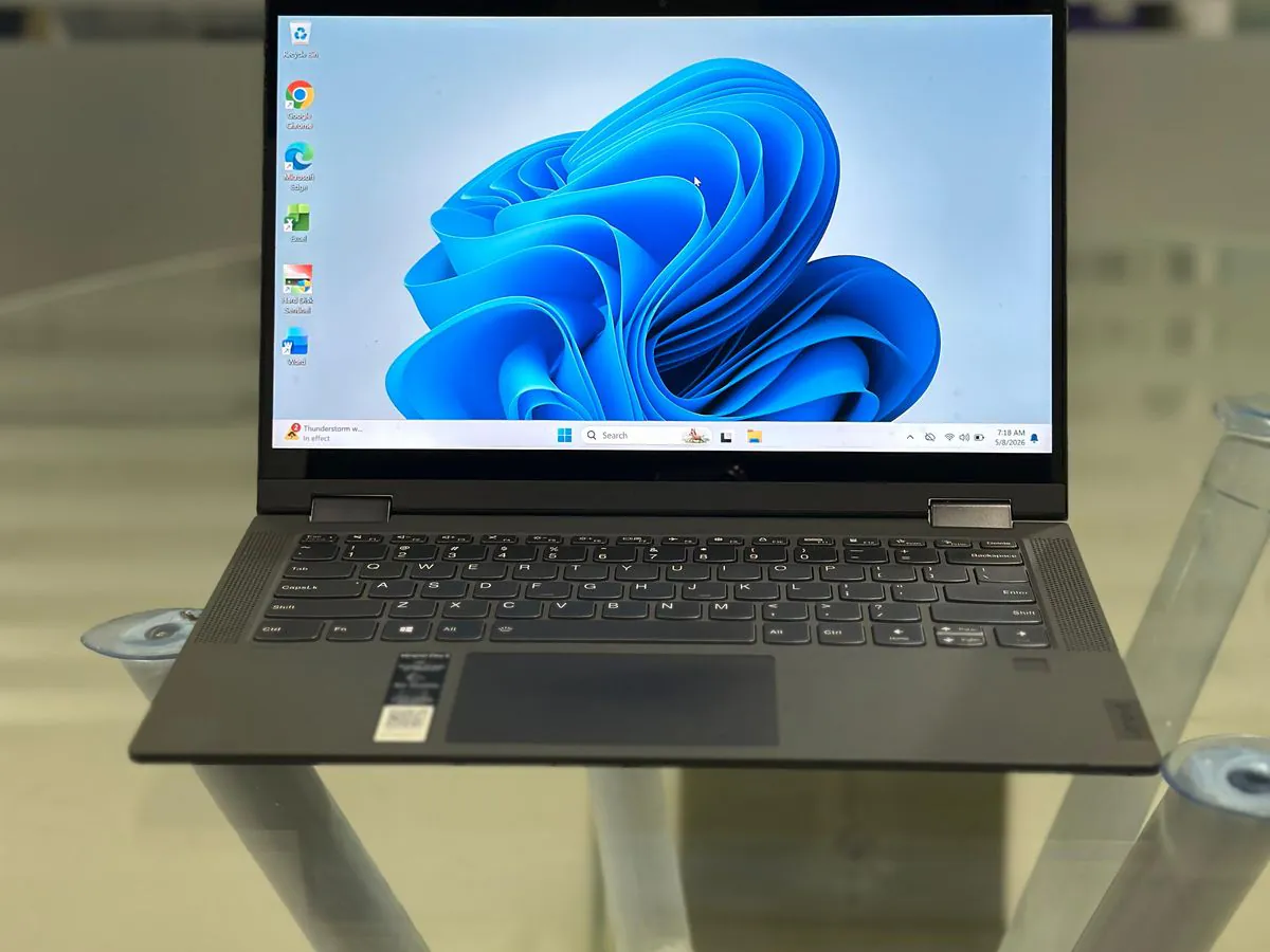 Lenovo IdeaPad Flex 5 14IIL05 open at an angle with the Windows 11 desktop on the 14-inch touch display and 360-degree hinge visible