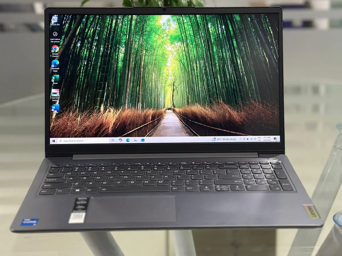 Lenovo IdeaPad Slim 3 15IAU7 open at an angle with the display on, full keyboard with numeric keypad and 15.6-inch FHD screen visible