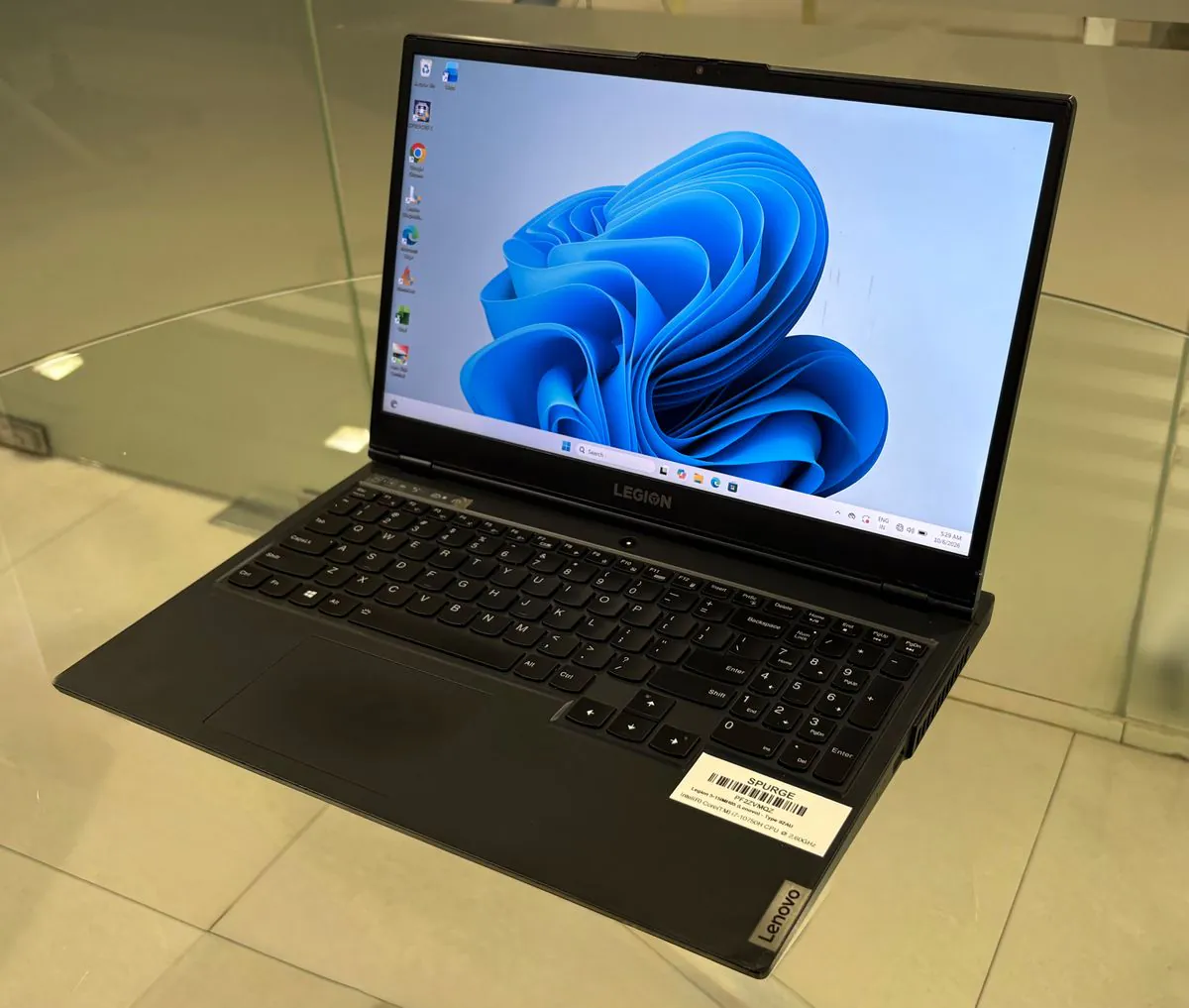 Lenovo Legion 5 15IMH05, open, three-quarter view from the right showing the display, keyboard and right-side vents