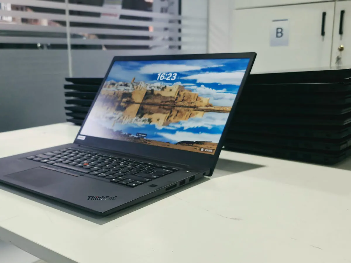 Lenovo ThinkPad P1 Gen 3 open at an angle with the display on, right side showing two USB-A ports and the side power button