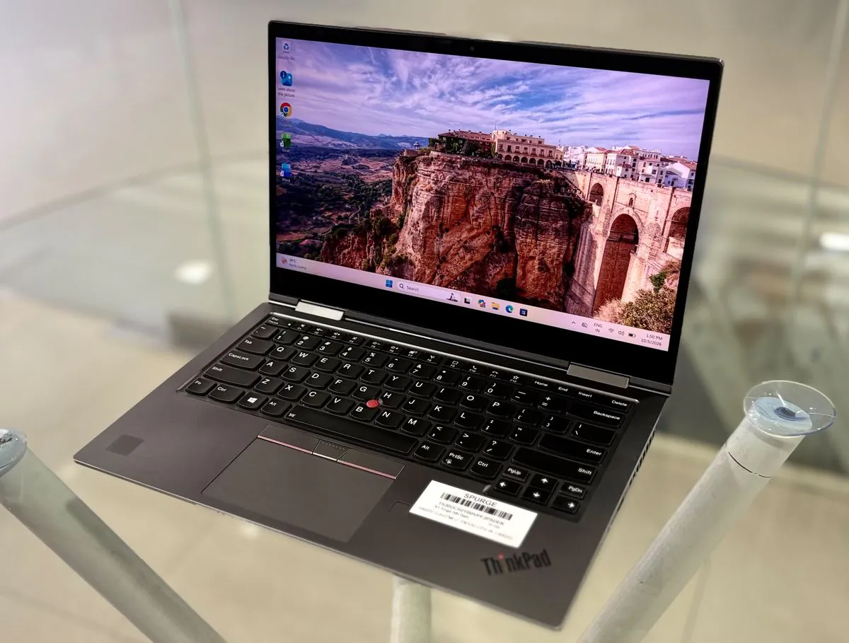 Lenovo ThinkPad X1 Yoga 5th Gen, open, three-quarter view from the right showing the 14-inch touch display and keyboard