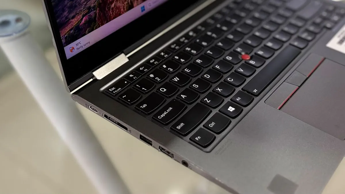 Lenovo ThinkPad X1 Yoga 5th Gen left side showing two USB-C Thunderbolt 3 ports, the docking connector, a USB-A port, HDMI and the audio jack