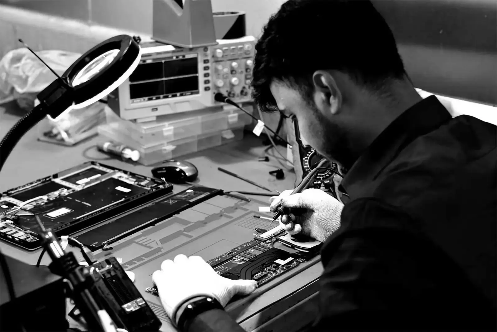 A SPURGE technician diagnosing a laptop
