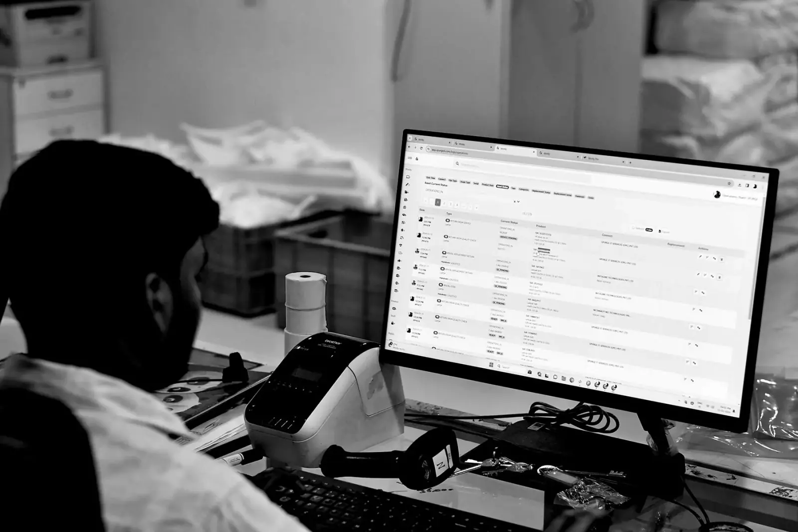SPURGE team member processing laptop rental operations